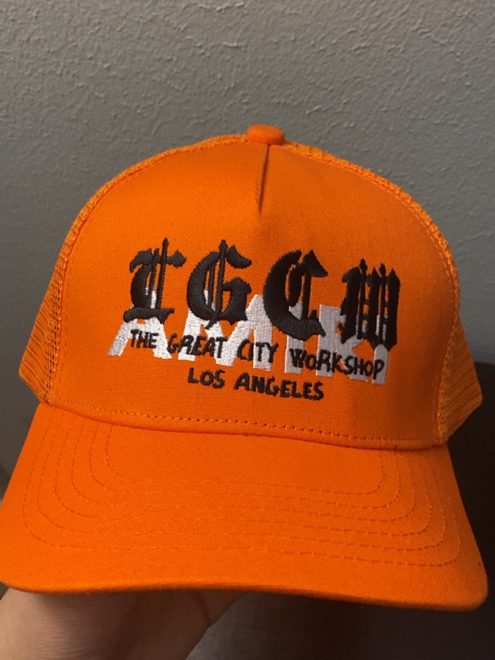 AMIRI Orange Trucker Hat with Black & White Logo
